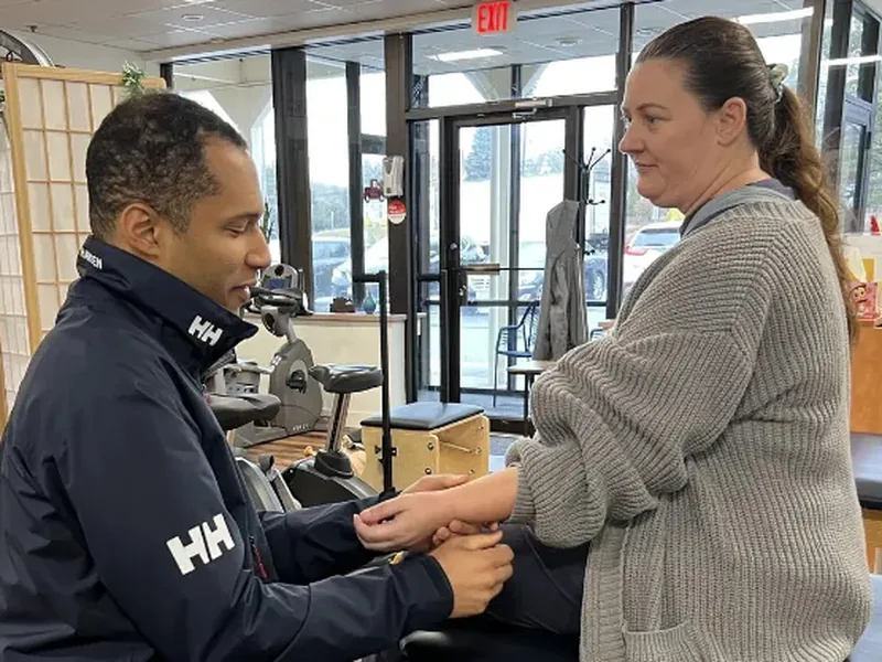 Physical therapist performing hands-on soft tissue treatment at Maritime Physical Therapy